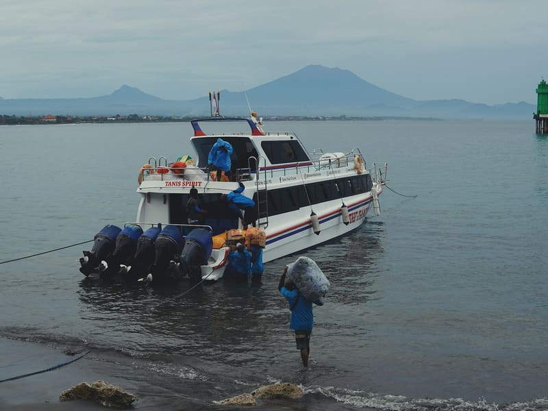 A fast boat moored off the beach, ready for boarding